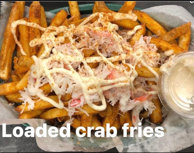 Sizzling Crispy Fries Topped With Crab Sour Cream Cheese And House Dressing.